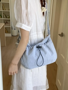 Light blue pleated dumpling bag with drawstring closure for casual commuting and students
