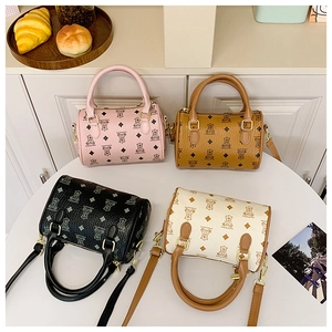 Mini Boston bags in four colors featuring cartoon bear prints and detachable straps