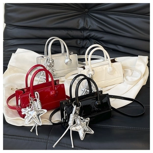 Mini patent leather crossbody bags in four colors with large silver star pendants