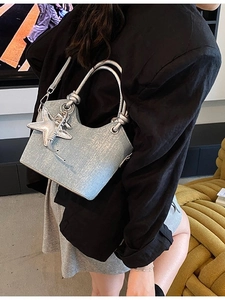 Light blue sequined bucket bag with silver starfish charm and round handle
