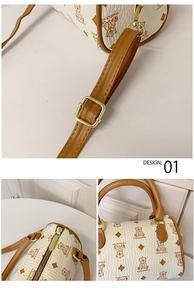 Detail showing the adjustable shoulder strap clasp and golden zipper of the beige mini bag
