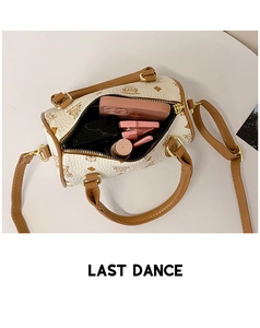 Detail view of the spacious interior of this chic off-white printed crossbody bag