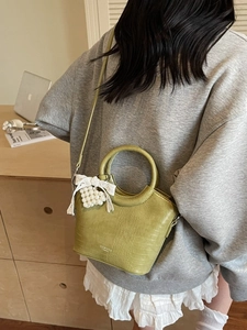 Olive green crocodile pattern bucket bag with ring handle and pearl heart charm