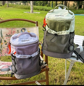 Outdoor backpack with breathable mesh pockets and drawstring closure in scenic green field