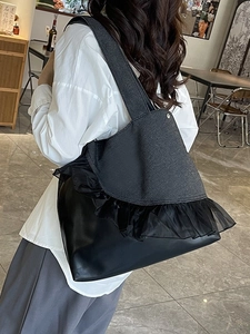 Chic black denim tote bag with ruffle trim and leather拼接 for daily commute and work