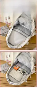 Internal layout of star print backpack with laptop pocket and multi-layer storage