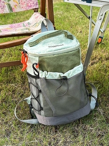 Lightweight outdoor hiking backpack in color-block green nylon with bungee cords