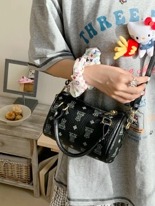 Fashionable black leather cylinder crossbody bag with green bear print for women