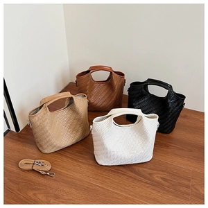 Detail showing herringbone texture on multi-color tote bags with adjustable straps