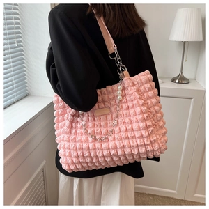 Close-up of pink bubble texture tote bag with pearl and floral silver metal chain