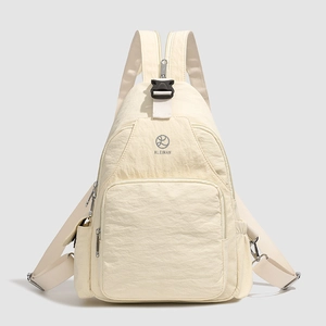 Detail of cream multifunctional nylon backpack with textured fabric and buckle