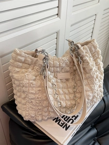 Off-white bubble texture tote bag with pearl chain and metallic flower charm detail