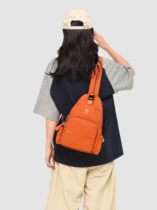 Bright orange nylon crossbody sling bag with multiple zip pockets for women's outdoor leisure