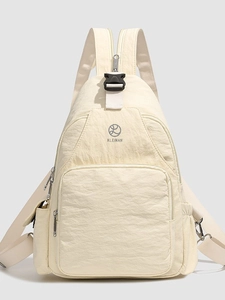 Versatile off-white nylon backpack with adjustable straps and front zip pocket