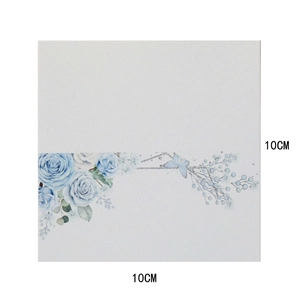 Detail of 10x10cm floral ceramic coaster featuring light blue roses and butterflies