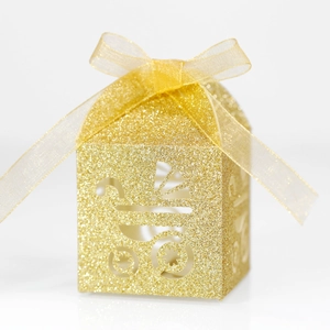 Detail of glitter gold baby carriage candy box with ribbon for baby shower parties
