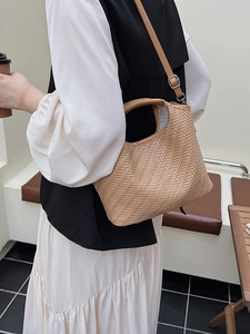 Minimalist beige woven tote bag with adjustable shoulder strap for women's casual style
