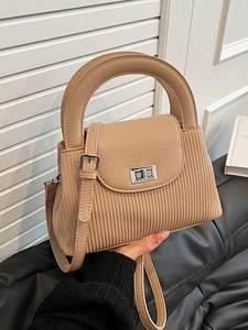 Chic beige pleated bucket handbag with lychee leather flap and silver metal turn-lock