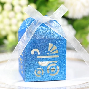 Blue glitter stroller cutout candy box with white ribbon bow for baby shower parties