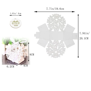 Macro view of white laser cut butterfly favor box with a thank you tag for party gifts