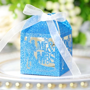 Detail view of blue glitter Mr & Mrs candy box with laser cut silhouette and white ribbon