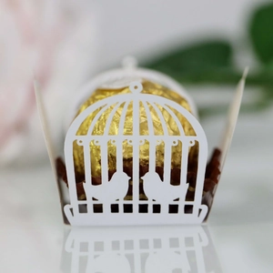 Laser cut white birdcage wedding favor box with intricate double bird silhouettes
