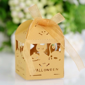 Macro detail of laser-cut Halloween candy box with pumpkin and ghost pattern