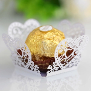 White laser-cut lace cupcake wrapper with hollow heart patterns for party favors