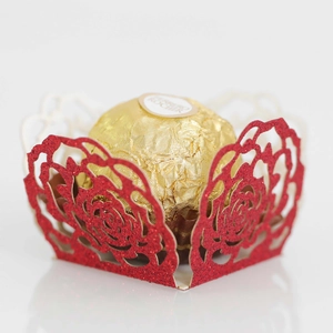 Macro shot of red glitter laser-cut rose hollow favor box for chocolate decoration