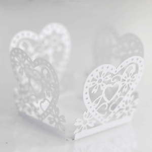 Detailed laser-cut heart and floral paper lace wrap for wedding candy and party cupcakes