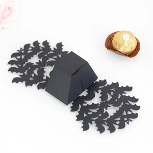 Detail view of black Halloween candy box with cutout bat wing base and matte finish