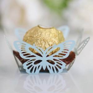 Detailed laser-cut butterfly cupcake wrapper in light blue for wedding candy decoration