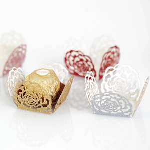 Laser-cut rose hollow chocolate wrappers in glittery gold and silver cardstock