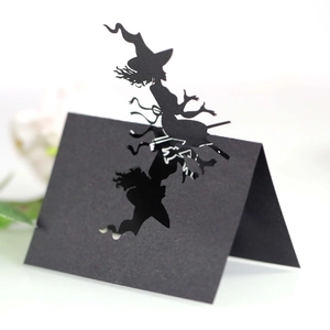 Laser-cut black witch riding broom silhouette place card for Halloween table decor