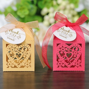 Detail of hollow heart gift boxes with glitter finish, satin ribbons and thank you tags