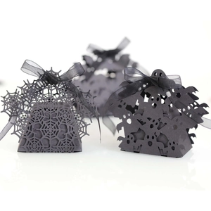 Halloween black laser-cut candy boxes with spider web and ghost motifs and ribbons