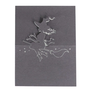 3D laser-cut black Halloween place card featuring a silhouette of a witch flying on a broomstick
