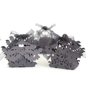 Laser-cut black Halloween gift boxes with bat and ghost patterns and organza ribbons