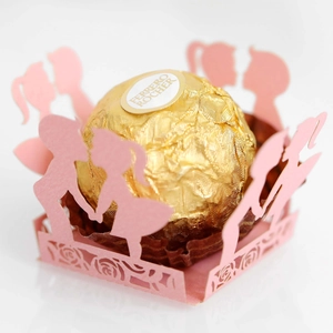 Detail of pink laser-cut hollow chocolate wrappers with romantic couple and rose pattern
