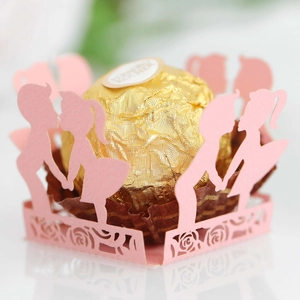 Pink laser cut paper chocolate wrapper featuring romantic couple silhouette and floral hollows