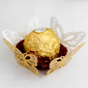 Detailed laser-cut gold butterfly chocolate truffle liner for festive party decor
