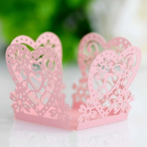 Detail of pink laser-cut hollow heart pattern on decorative wedding favor paper box