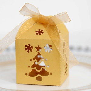 Detailed view of golden Christmas tree hollow gift box with a delicate organza ribbon bow