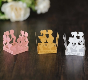 Hollow-out paper party lanterns with laser-cut romantic silhouettes in pink gold white