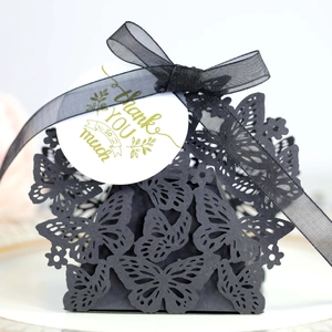 Elegant black laser-cut butterfly gift box with black ribbon and Thank You tag