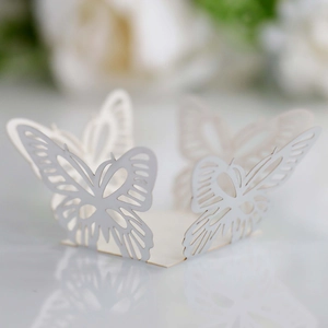 Detailed laser-cut white butterfly cupcake wrapper with elegant hollow lace pattern