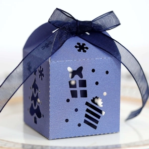 Laser cut Christmas tree gift box in blue-violet with navy ribbon and snowflake patterns
