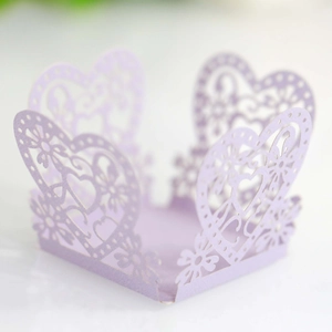 Close-up of laser-cut lavender lace paper box with heart patterns and glitter finish