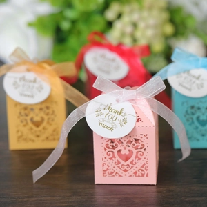 Pink heart laser-cut candy box with thank you tag and ribbon for wedding favors