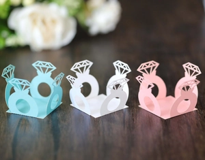 Detailed laser-cut hollow diamond ring paper favor boxes in blue, white, and pink colors